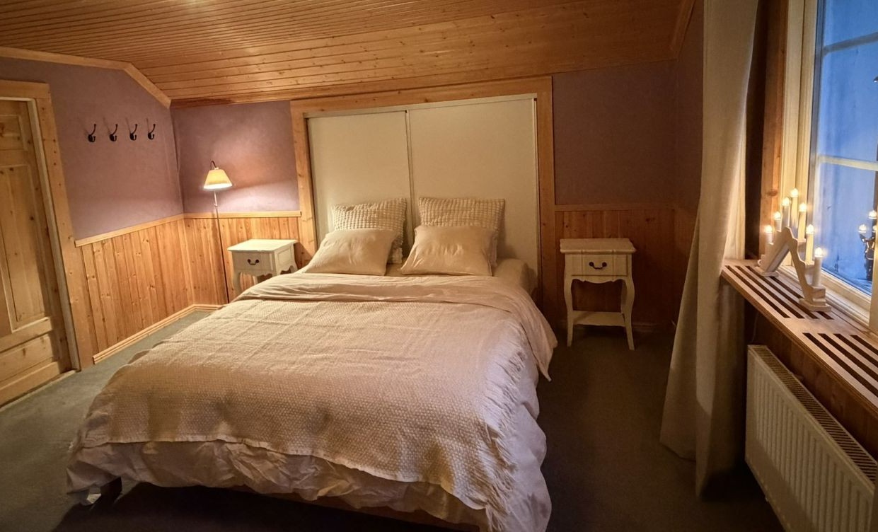 Cozy bedroom at Lappvall Lodge in Swedish Lapland